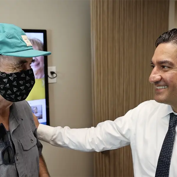 Dr. Ghafoori Embracing Patient